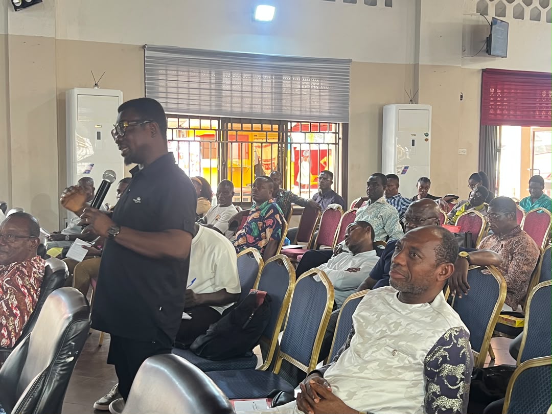 Participant contributing to a discussion at the Tech4Christ training programme.